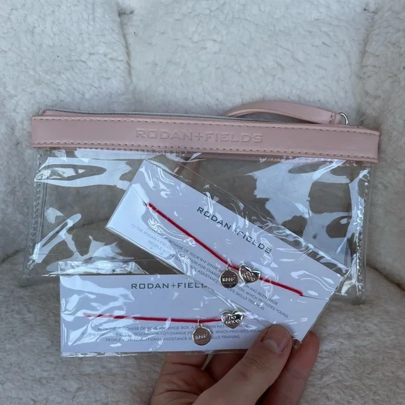 Rodan + Fields Clear Cosmetic Bag with Red Bracelets NEW - Picture 2 of 5